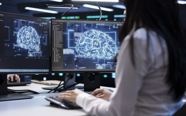 programerka uporablja umetno inteligenco na racunalniku